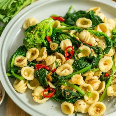  Orecchiette con le cime di rapa:  A Symphony of Ear-Shaped Pasta and Savory Greens in Italy's Culinary Wonderland